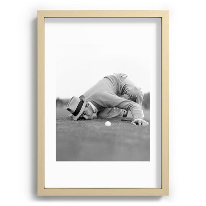 Eye to the ground on the 18th hole; golfing man eyes ball to measure distance to hole vintage black and white portrait photograph - photography - photographs poster Framed Art Print Gallery Image 97