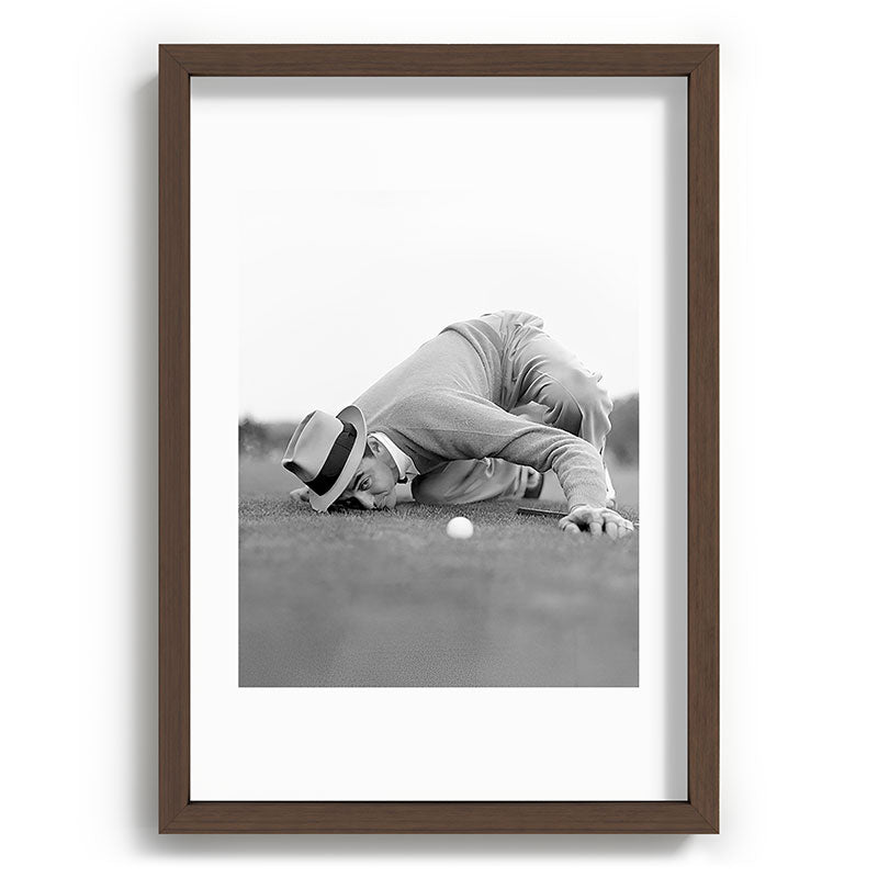 Eye to the ground on the 18th hole; golfing man eyes ball to measure distance to hole vintage black and white portrait photograph - photography - photographs poster Framed Art Print Gallery Image 89