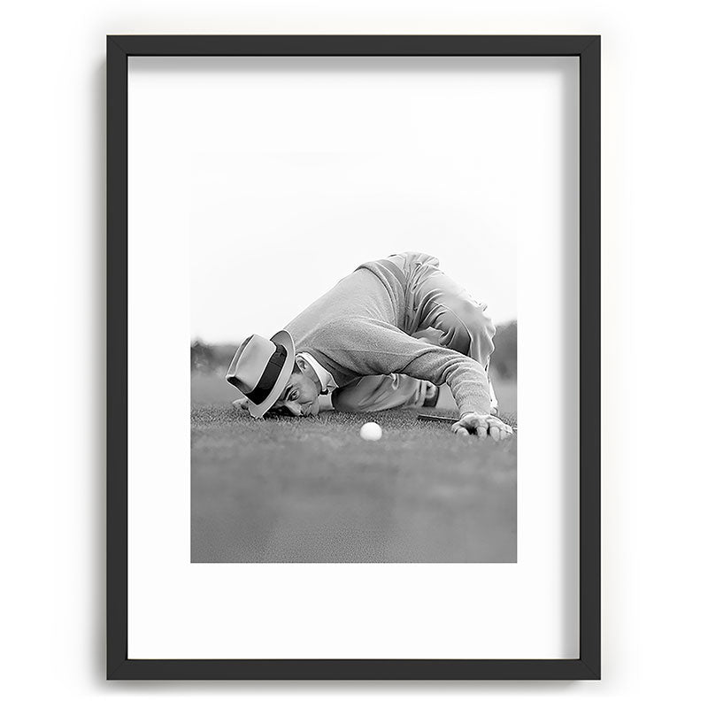 Eye to the ground on the 18th hole; golfing man eyes ball to measure distance to hole vintage black and white portrait photograph - photography - photographs poster Framed Art Print Gallery Image 84