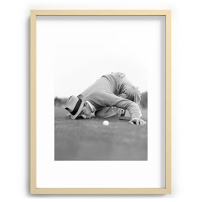 Eye to the ground on the 18th hole; golfing man eyes ball to measure distance to hole vintage black and white portrait photograph - photography - photographs poster Framed Art Print Gallery Image 99