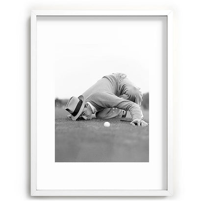 Eye to the ground on the 18th hole; golfing man eyes ball to measure distance to hole vintage black and white portrait photograph - photography - photographs poster Framed Art Print Gallery Image 108