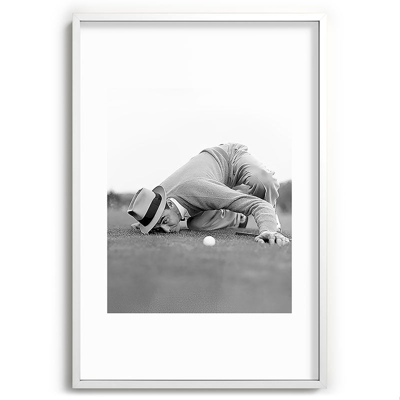 Eye to the ground on the 18th hole; golfing man eyes ball to measure distance to hole vintage black and white portrait photograph - photography - photographs poster Framed Art Print Gallery Image 110
