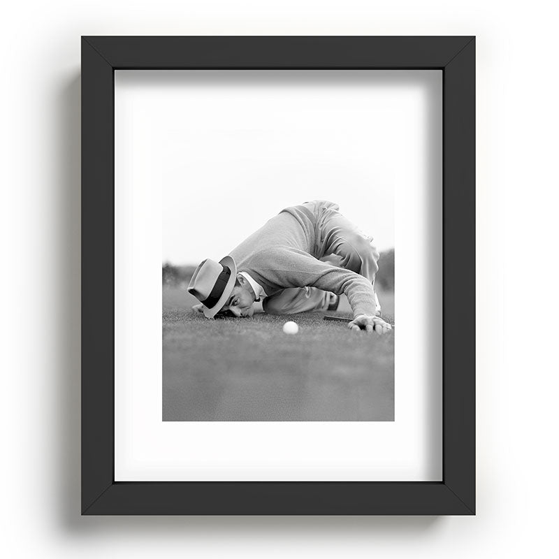 Eye to the ground on the 18th hole; golfing man eyes ball to measure distance to hole vintage black and white portrait photograph - photography - photographs poster Framed Art Print Gallery Image 78