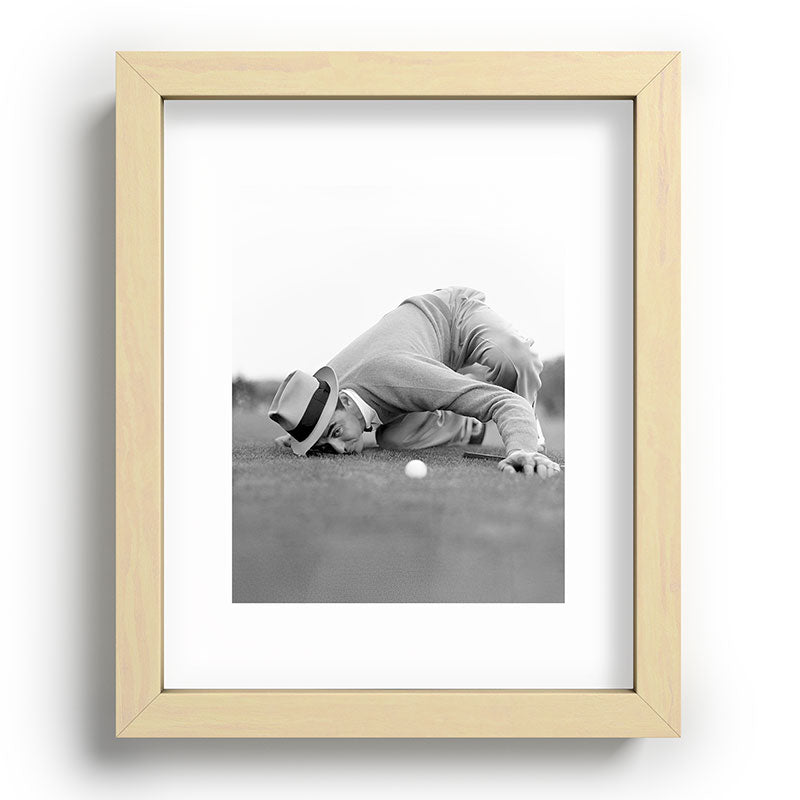 Eye to the ground on the 18th hole; golfing man eyes ball to measure distance to hole vintage black and white portrait photograph - photography - photographs poster Framed Art Print Gallery Image 96