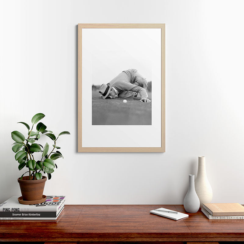 Eye to the ground on the 18th hole; golfing man eyes ball to measure distance to hole vintage black and white portrait photograph - photography - photographs poster Framed Art Print Gallery Image 65