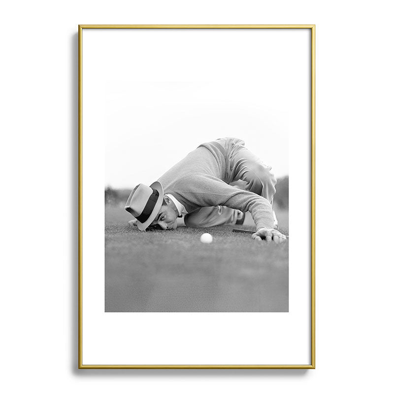 Eye to the ground on the 18th hole; golfing man eyes ball to measure distance to hole vintage black and white portrait photograph - photography - photographs poster Framed Art Print Gallery Image 123