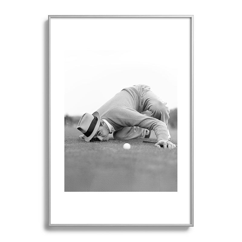Eye to the ground on the 18th hole; golfing man eyes ball to measure distance to hole vintage black and white portrait photograph - photography - photographs poster Framed Art Print Gallery Image 132