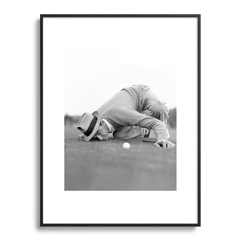 Eye to the ground on the 18th hole; golfing man eyes ball to measure distance to hole vintage black and white portrait photograph - photography - photographs poster Framed Art Print Gallery Image 115