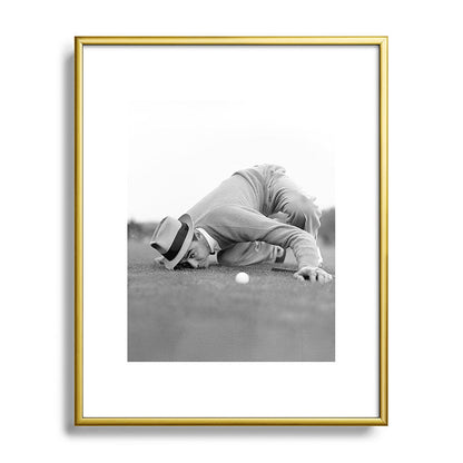 Eye to the ground on the 18th hole; golfing man eyes ball to measure distance to hole vintage black and white portrait photograph - photography - photographs poster Framed Art Print Gallery Image 121