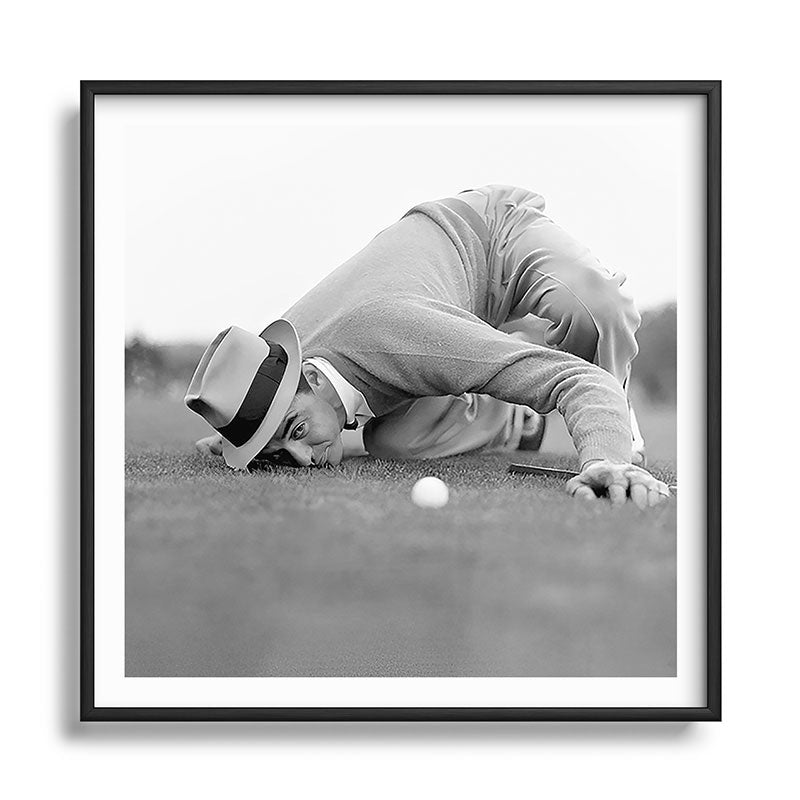 Eye to the ground on the 18th hole; golfing man eyes ball to measure distance to hole vintage black and white portrait photograph - photography - photographs poster Framed Art Print Gallery Image 122