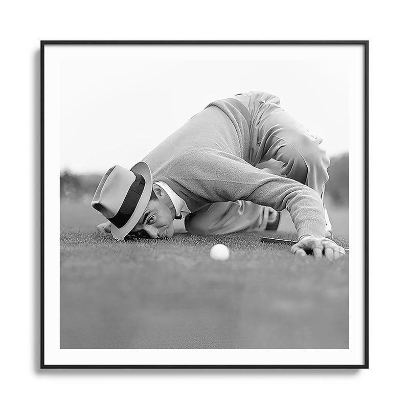Eye to the ground on the 18th hole; golfing man eyes ball to measure distance to hole vintage black and white portrait photograph - photography - photographs poster Framed Art Print Gallery Image 126