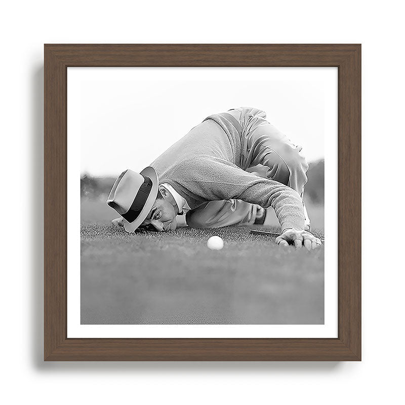 Eye to the ground on the 18th hole; golfing man eyes ball to measure distance to hole vintage black and white portrait photograph - photography - photographs poster Framed Art Print Gallery Image 13