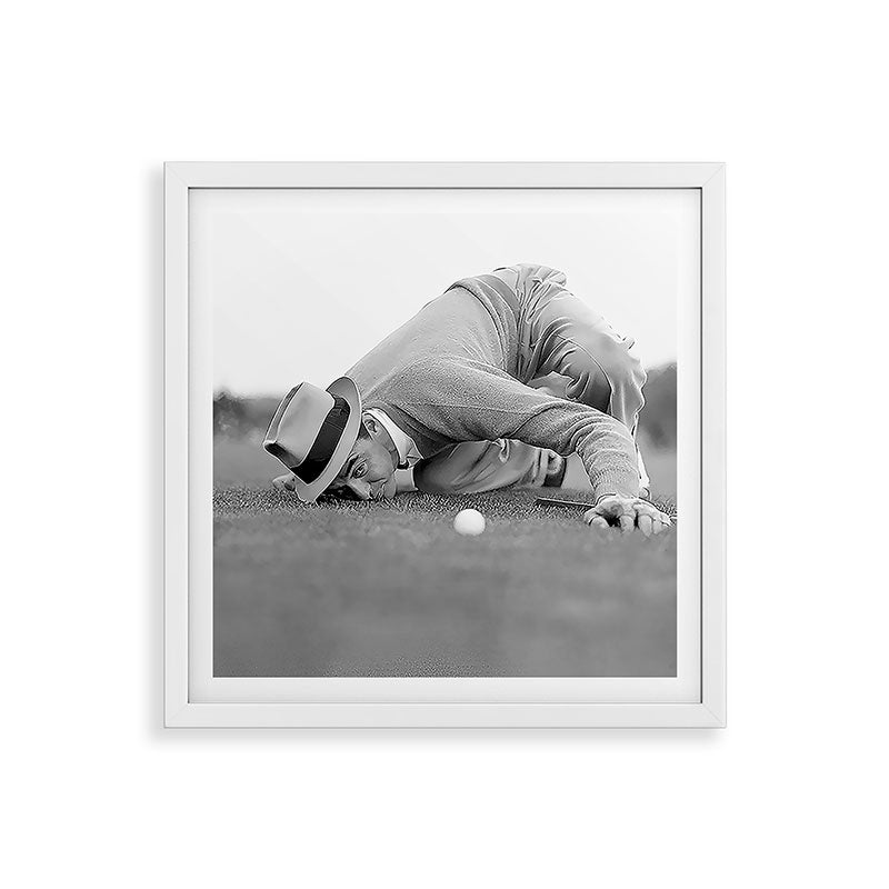 Eye to the ground on the 18th hole; golfing man eyes ball to measure distance to hole vintage black and white portrait photograph - photography - photographs poster Framed Art Print Gallery Image 38