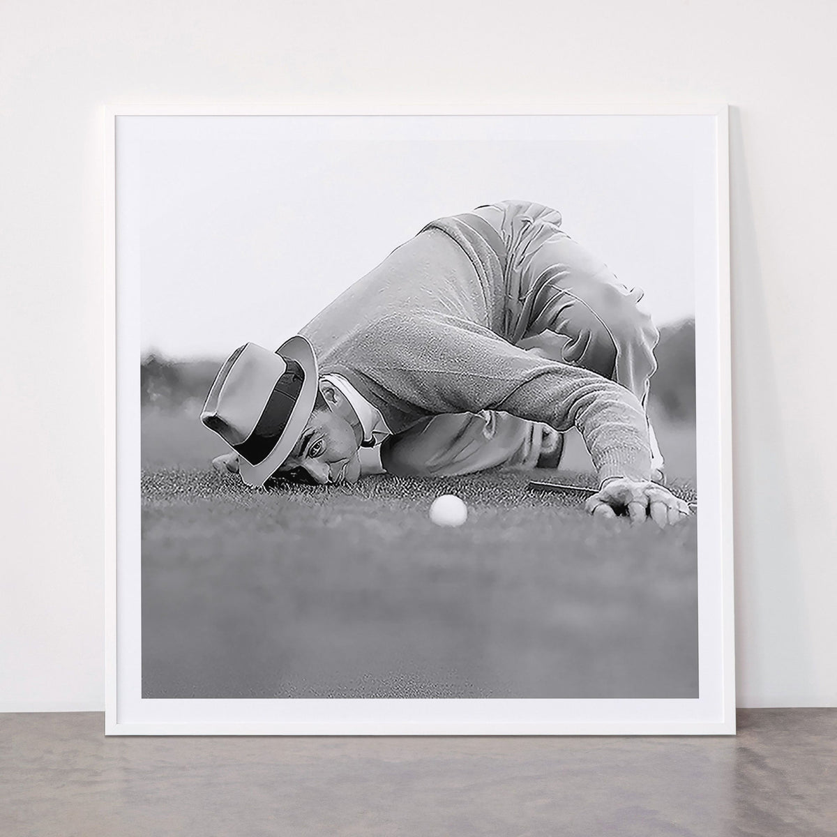 Eye to the ground on the 18th hole; golfing man eyes ball to measure distance to hole vintage black and white portrait photograph - photography - photographs poster Framed Art Print Gallery Image 43