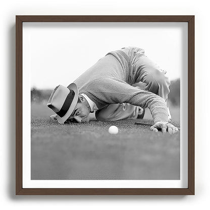 Eye to the ground on the 18th hole; golfing man eyes ball to measure distance to hole vintage black and white portrait photograph - photography - photographs poster Framed Art Print Gallery Image 101