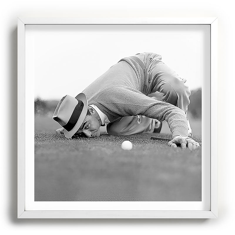 Eye to the ground on the 18th hole; golfing man eyes ball to measure distance to hole vintage black and white portrait photograph - photography - photographs poster Framed Art Print Gallery Image 118