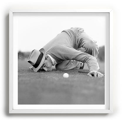 Eye to the ground on the 18th hole; golfing man eyes ball to measure distance to hole vintage black and white portrait photograph - photography - photographs poster Framed Art Print Gallery Image 118