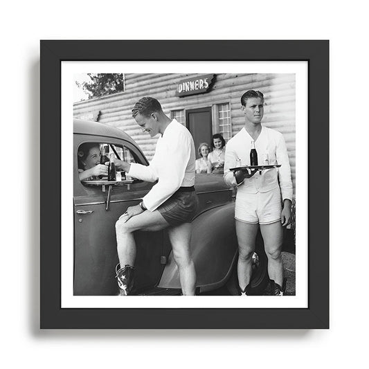 Texas love, male drive-in car hops in shorts and cowboy boots at drive in tavern near Love Field Airport in Dallas vintage black and white photograph - photography - photographs Framed Art Print Gallery Image 2